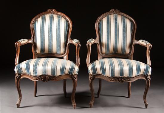 Pair of Louis XV style carved fruitwood