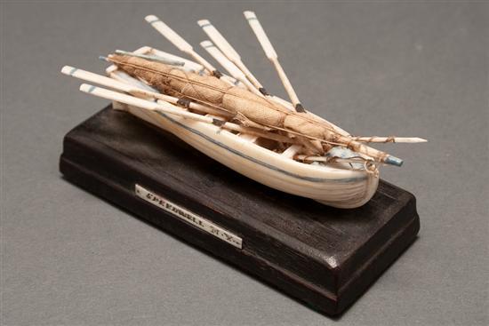 Miniature carved ivory whaling boat