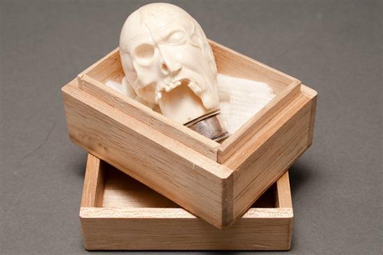 Continental carved ivory half-skull