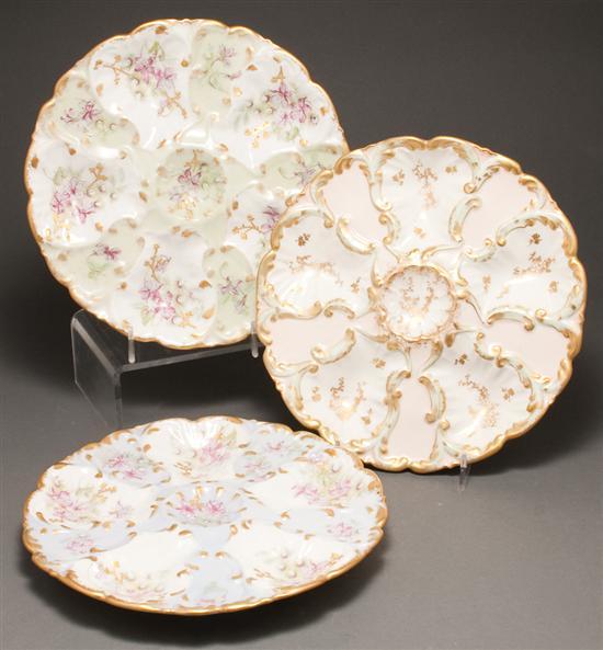 Three Limoges floral painted parcel-gilt