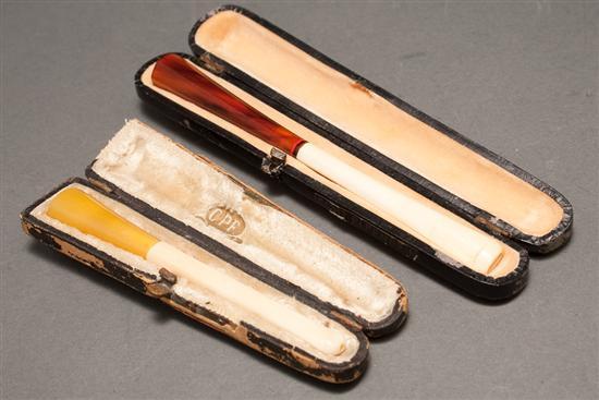 Two Art Deco ivory and celluloid cigarette