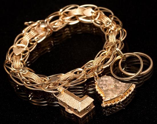 Lady's 14K yellow gold charm bracelet