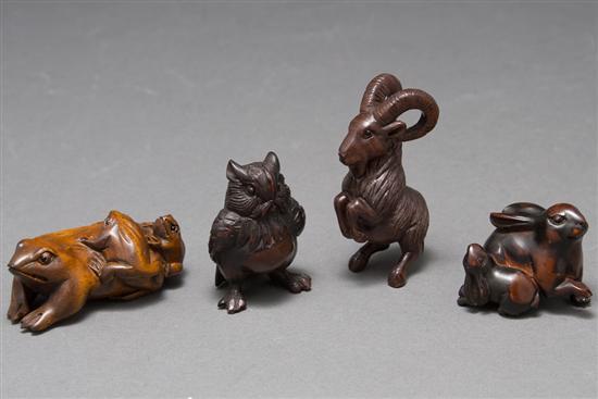 Four Japanese carved wood netsukes 1)