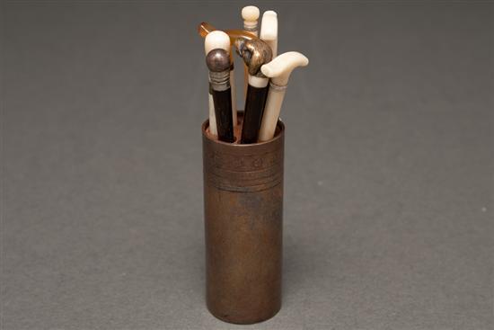 Seven miniature canes with an etched