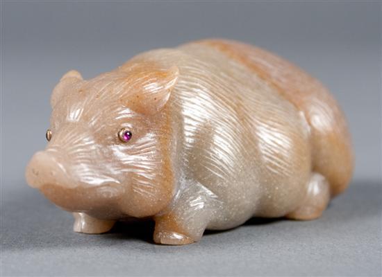 Carved hardstone pig with ruby