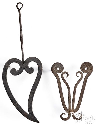 TWO PENNSYLVANIA WROUGHT IRON TRIVETSTwo