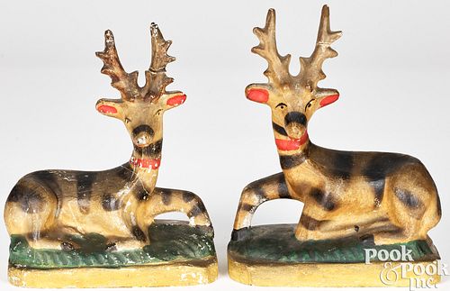 PAIR OF CHALKWARE RECUMBENT STAGS,