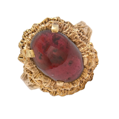 A red gem set 9ct gold bark textured