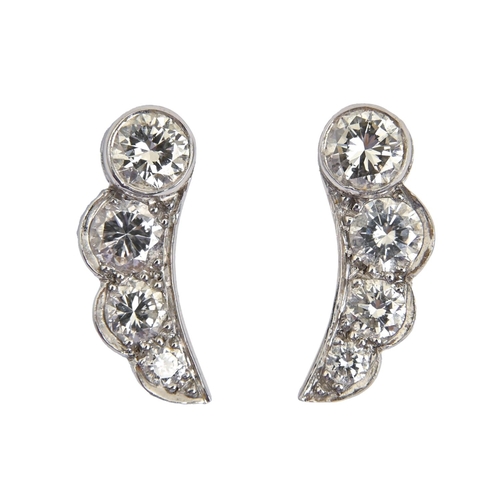 A pair of diamond earrings,  of