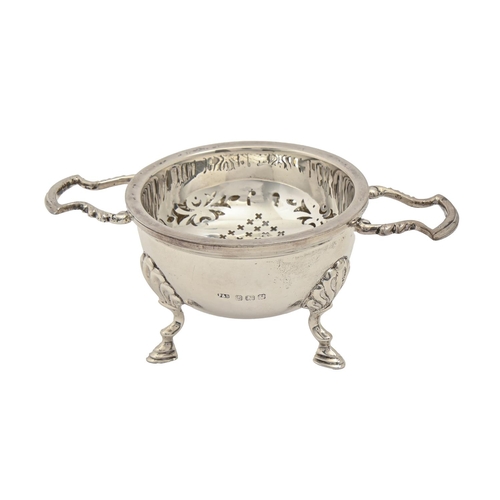 A George V silver tea strainer