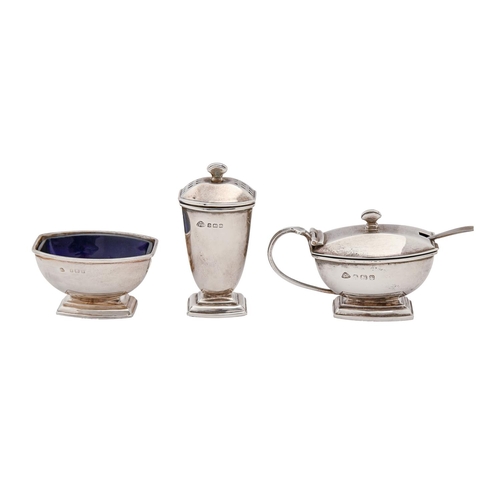 A silver condiment set, blue glass