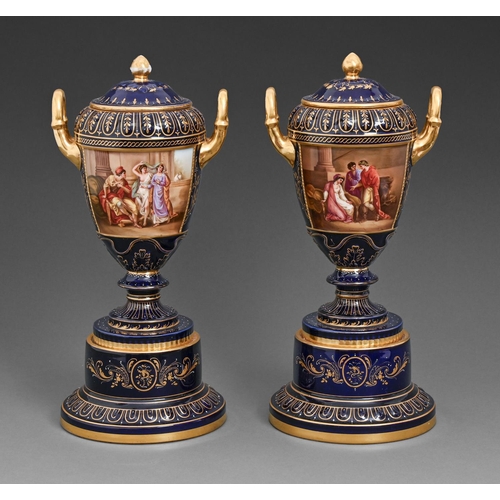 A pair of Vienna style vases, pedestals