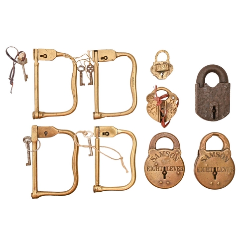 Four brass luggage locks, late 19th