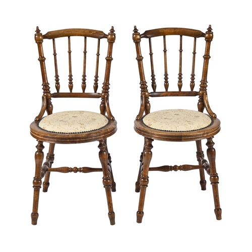 A pair of turned beech chairs,
