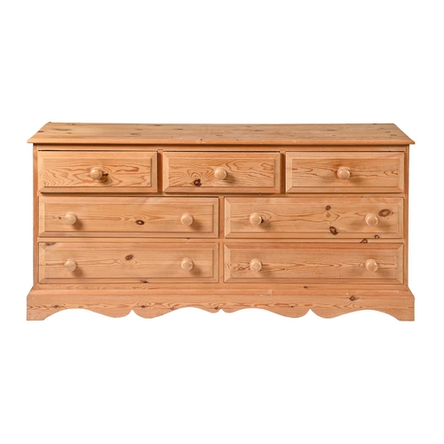 A waxed pine chest of drawers,