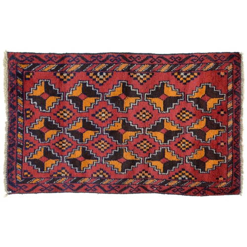 An Afghan Baluch rug, 135 x 84cm