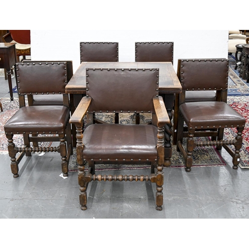 An oak draw leaf table and set of seven