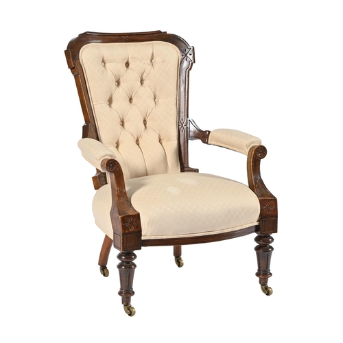 An Edwardian walnut armchair, on