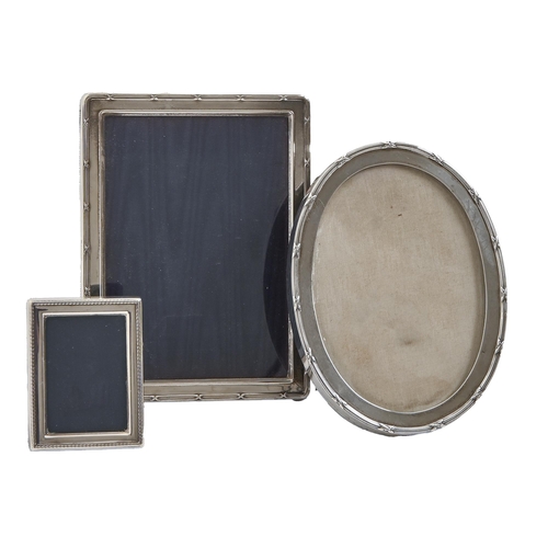 A George V oval silver photograph frame,