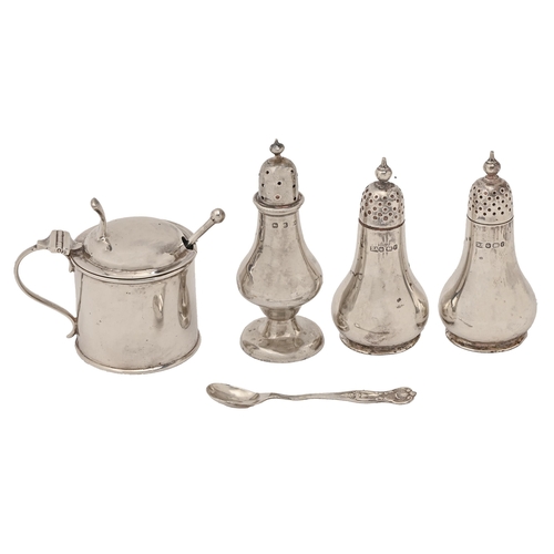 A pair of Victorian silver pepperettes