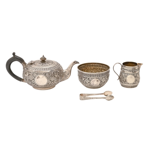A Victorian silver repousse tea