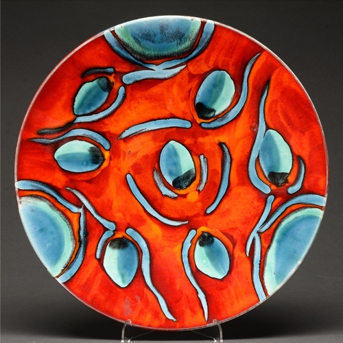A Poole Pottery peacock charger designed