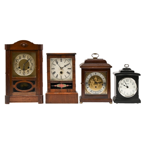 A 1930s stained wood mantel clock, the