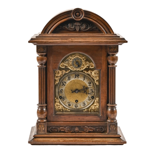 A German walnut clock, with brass and