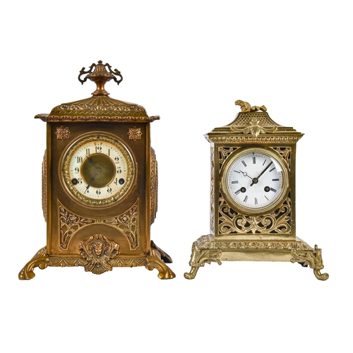 An ornate cast brass mantel clock,