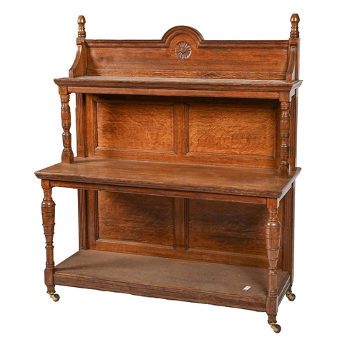 A Victorian oak buffet or moving sideboard,