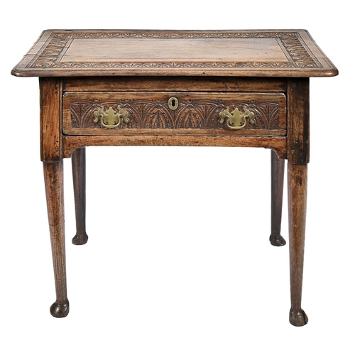 A George III oak side table, carved