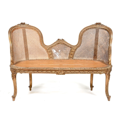 A French giltwood and caned settee,