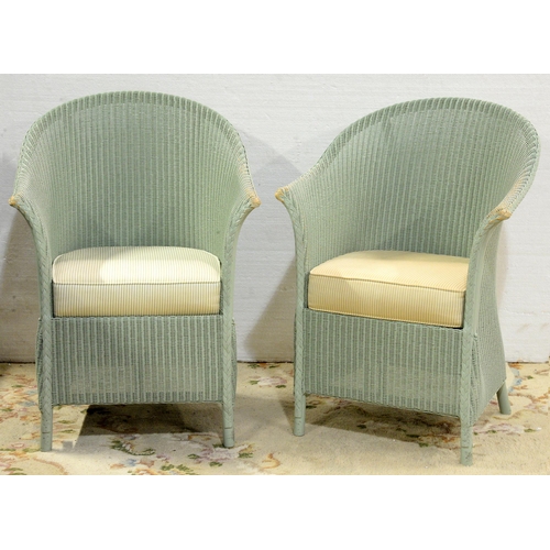 A pair of Lloyd Loom elbow chairs,