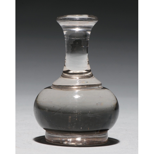 A glass desk weight of gavel form,