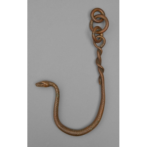 A bronze hanging sculpture of a snake