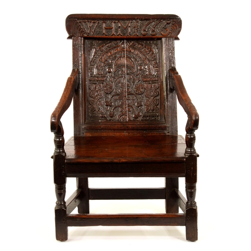 A Charles II oak panel-back armchair,
