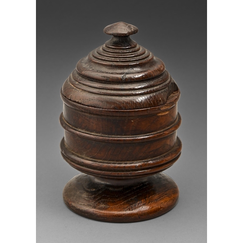 Treen. An oak mortar and cover,