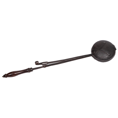 An iron long handled lidded pan, late