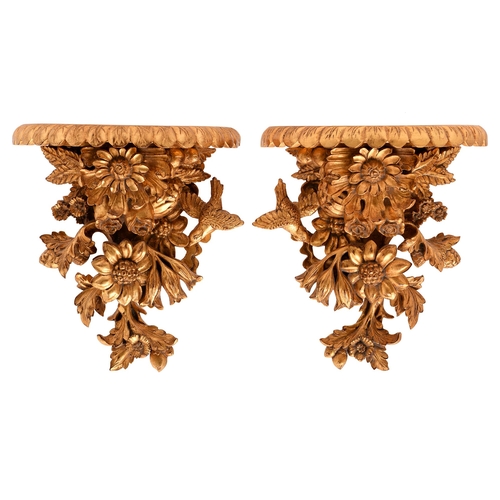 A pair of carved wood wall brackets,