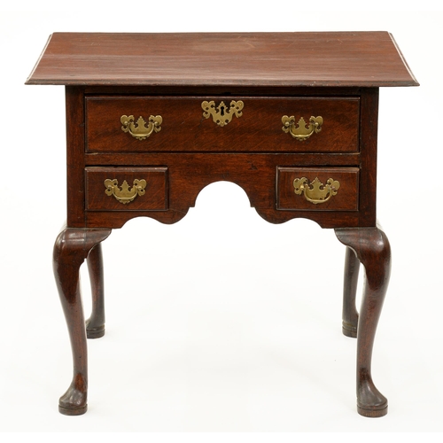 A George II oak lowboy, the one-piece,