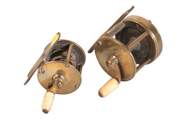 A BRASS WINCH FISHING REEL with turned