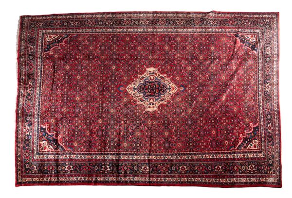 A HOSSEINABAD CARPET woven in muted