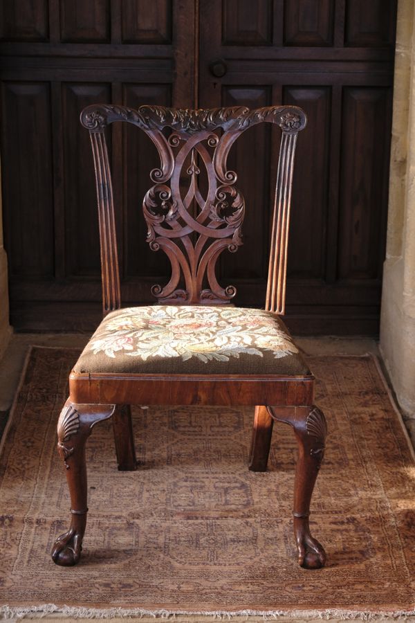 A GEORGE II WALNUT CHAIR in the