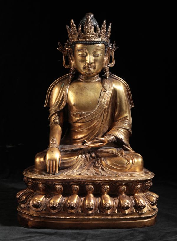 A CHINESE GILT-BRONZE BUDDHA early