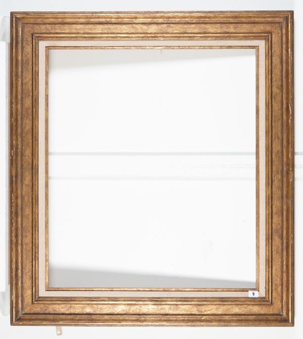 A GILT FRAME WITH CANVAS SLIP;