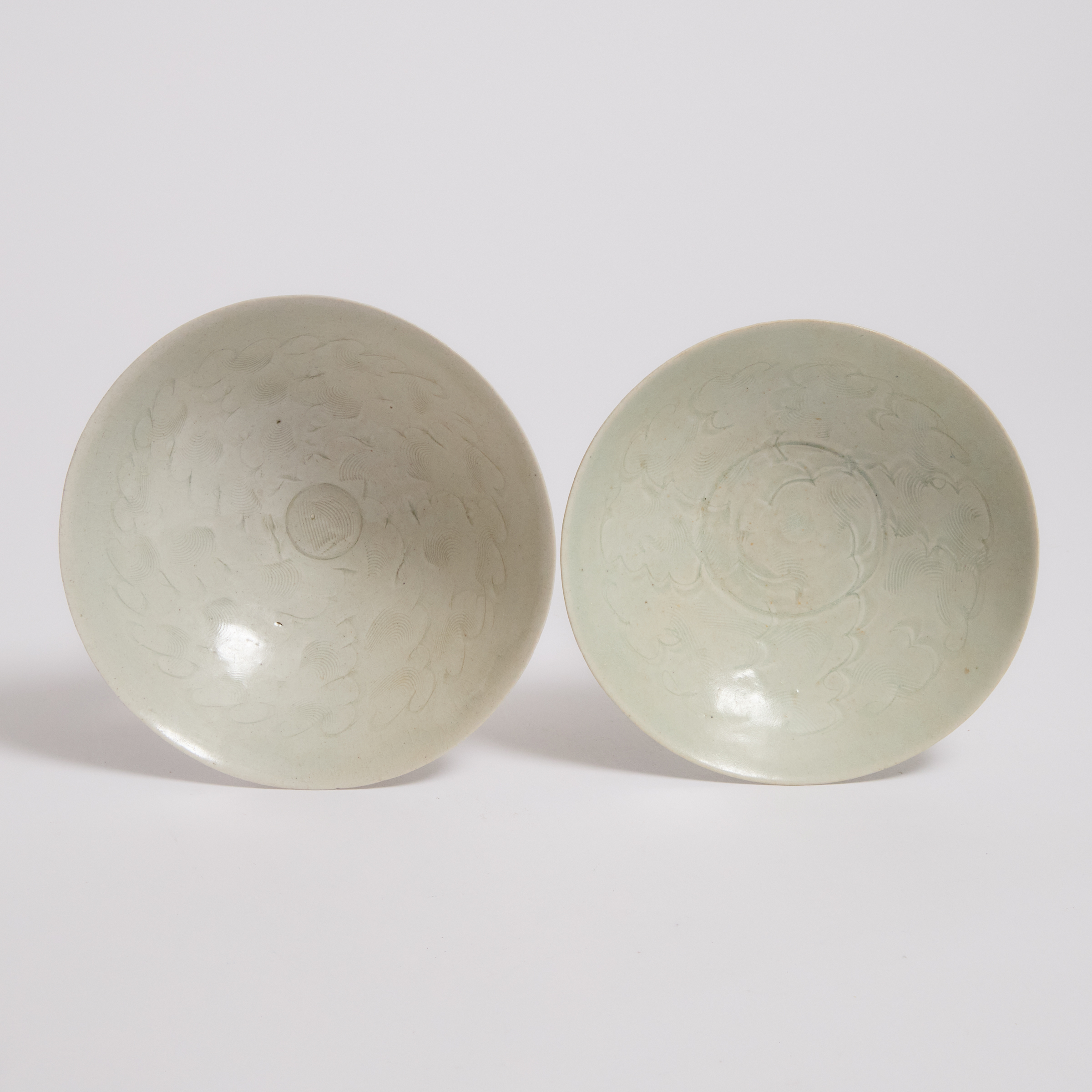 Two Carved Qingbai 'Floral' Bowls,