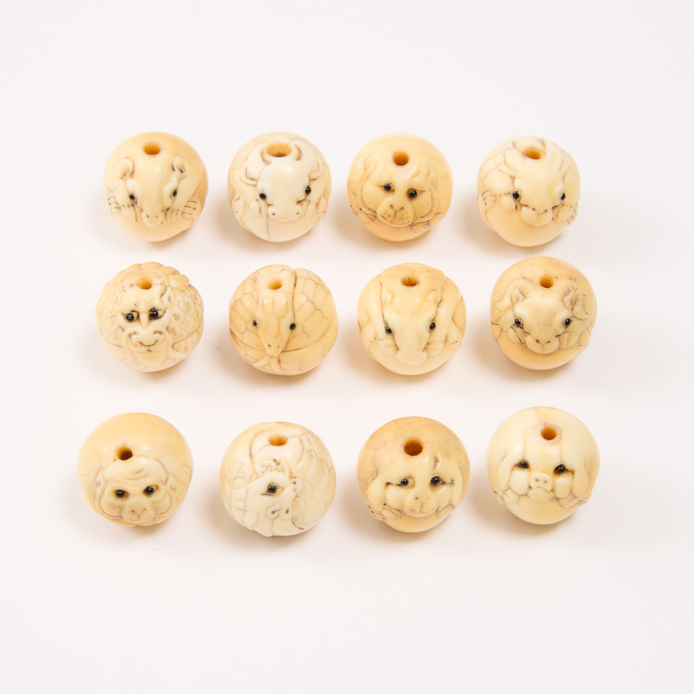 A Set of Twelve Ivory Zodiac Ojime