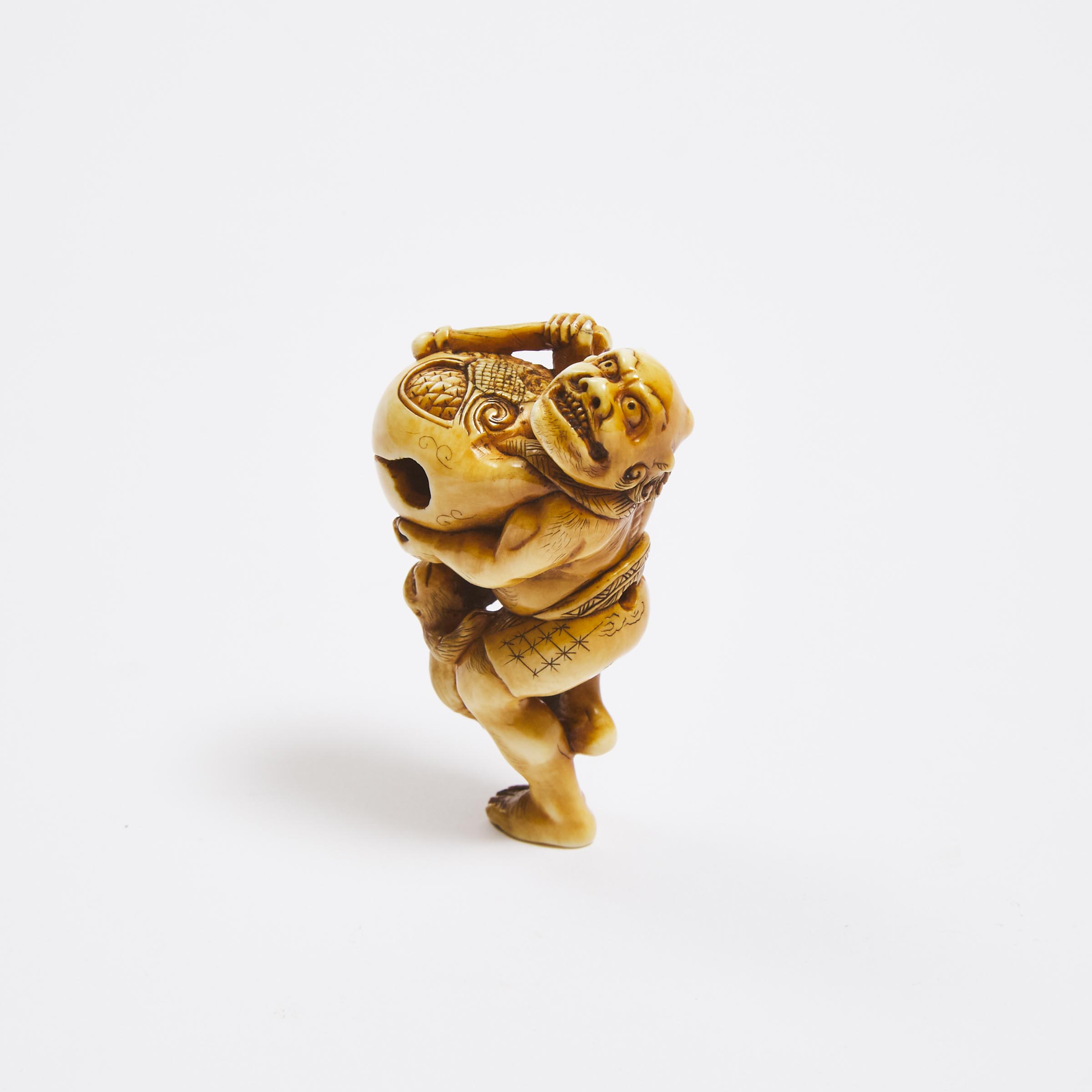 An Ivory Netsuke of an Oni and