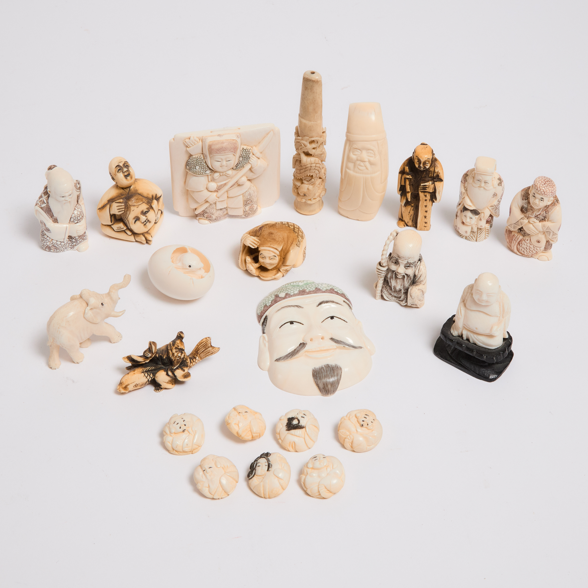 A Group of Twenty-Two Ivory Carvings,