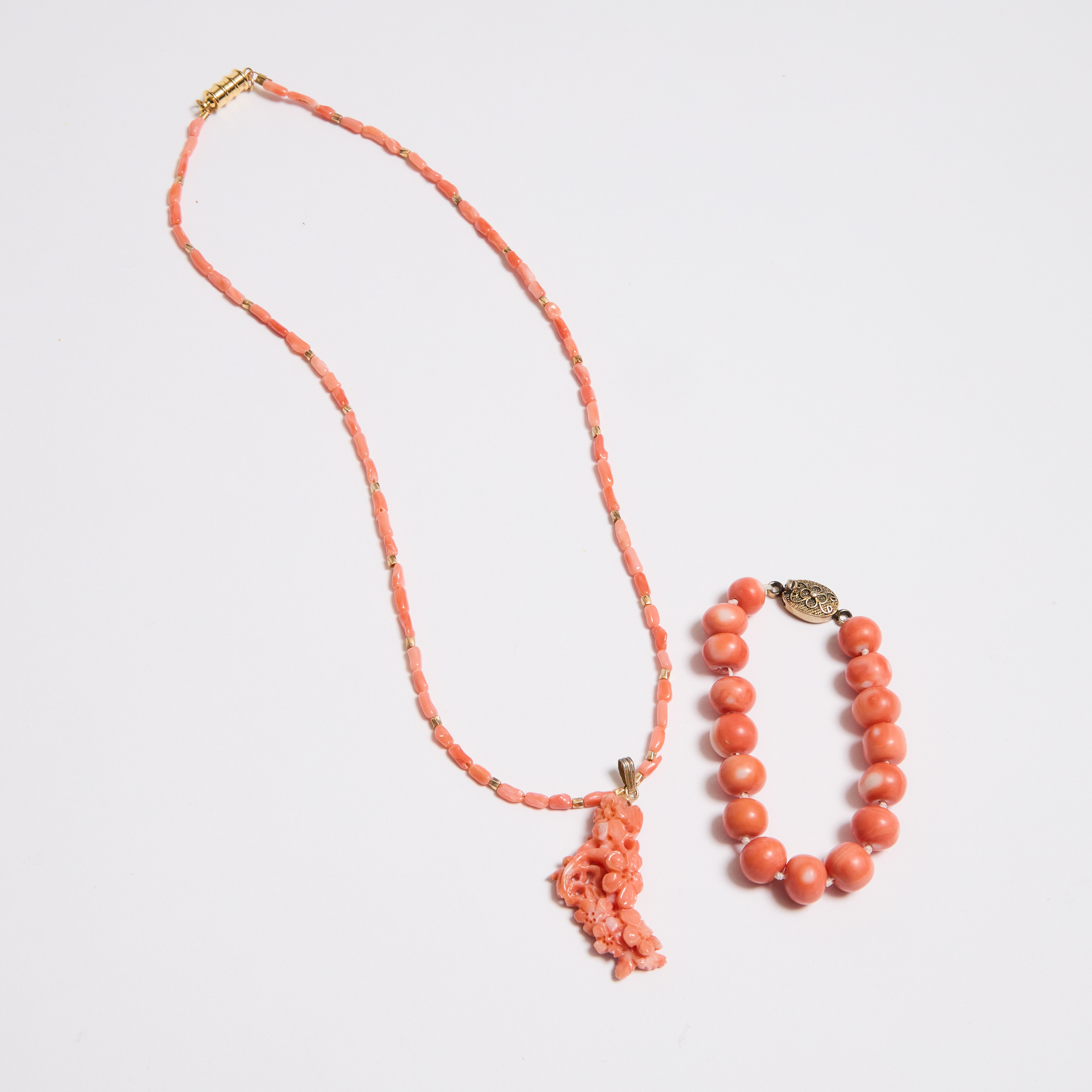 A Carved Coral 'Flowers' Pendant,